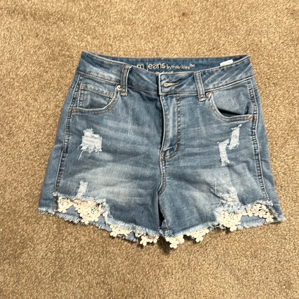 Mid rise, light blue, Maurice’s jean shorts in size 0 with white flowers under